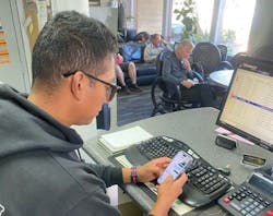 1672943865929 Tire Man Texting 1672943865929 Tire Man Texting