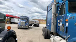 Exit_11_Tire_trucks_on_lot-resized