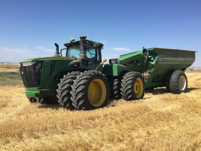 Titan_green_Deere_tractor_and_wagon_in-wheat_field