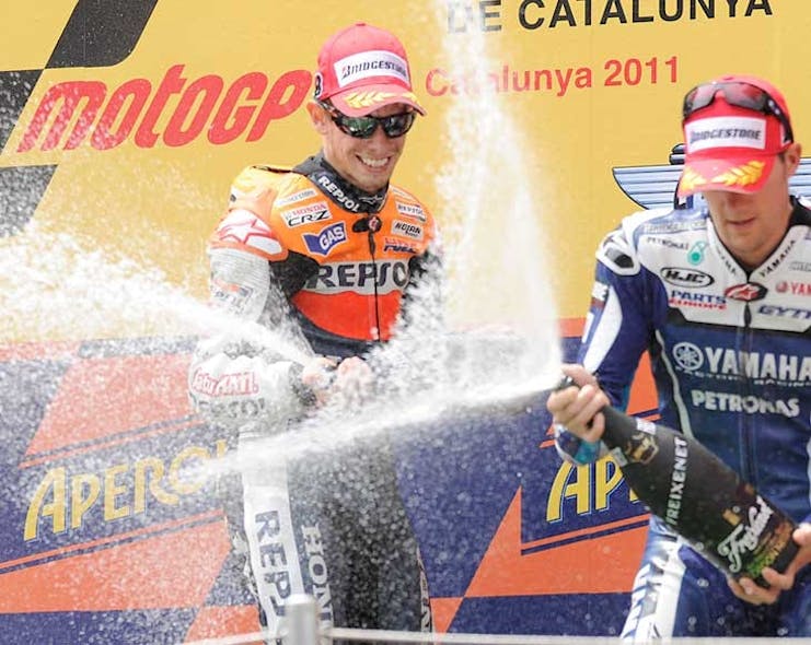 stoner-triumphs-in-tricky-conditions-at-catalunya