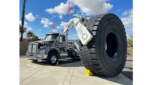 OTR Tire Conference attendees were greeted by a Stellar Industries-built boom truck owned by Purcell Tire &amp; Rubber Co. holding a new 63-inch tire made by Goodyear Tire &amp; Rubber Co.