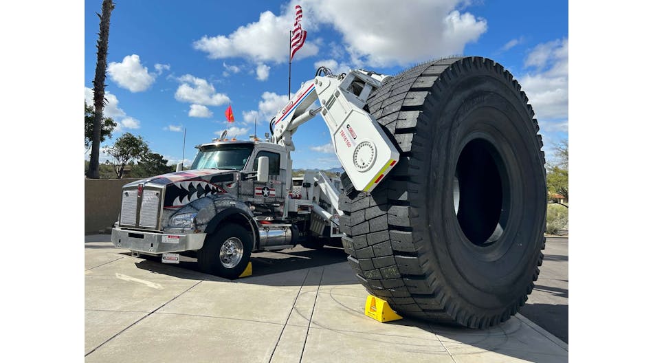 OTR Tire Conference attendees were greeted by a Stellar Industries-built boom truck owned by Purcell Tire &amp; Rubber Co. holding a new 63-inch tire made by Goodyear Tire &amp; Rubber Co.