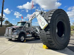 OTR Tire Conference attendees were greeted by a Stellar Industries-built boom truck owned by Purcell Tire & Rubber Co. holding a new 63-inch tire made by Goodyear Tire & Rubber Co. OTR Tire Conference attendees were greeted by a Stellar Industries-built boom truck owned by Purcell Tire & Rubber Co. holding a new 63-inch tire made by Goodyear Tire & Rubber Co.