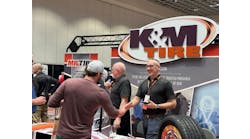 K&amp;M Tire associates greet attendees at the company&apos;s annual Dealer Conference and Trade Show in Las Vegas, Nev.