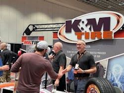 K&M Tire associates greet attendees at the company's annual Dealer Conference and Trade Show in Las Vegas, Nev. K&M Tire associates greet attendees at the company's annual Dealer Conference and Trade Show in Las Vegas, Nev.