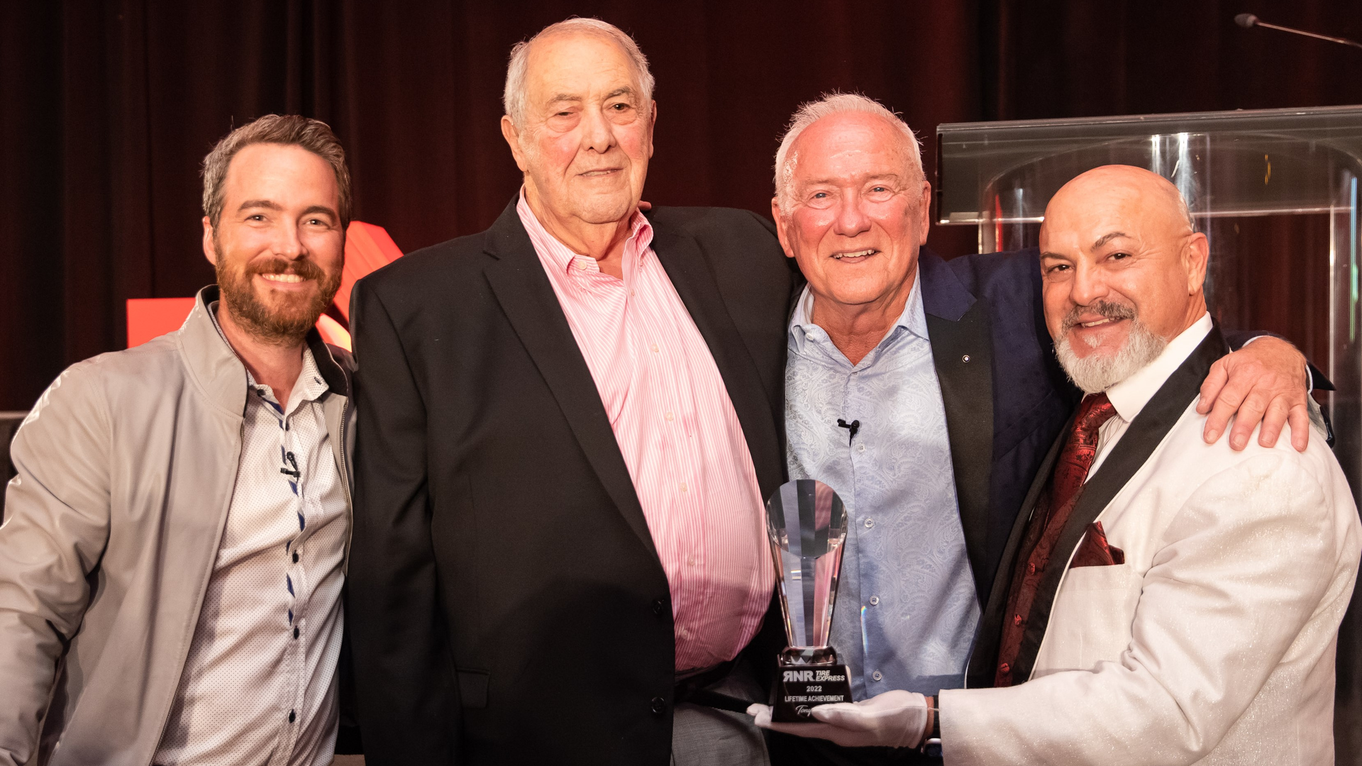 RNR Tire Express recently presented a Lifetime Achievement award to Tony Raffo (second from left.)