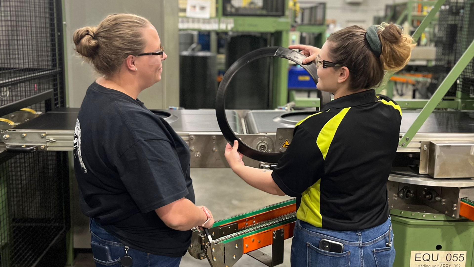 At the Nokian factory in Dayton, Tenn., experienced workers are serving as mentors to new employees on the production floor. Mentor Emily Gatlin works with Trainee Katelyn Peavyhouse.
