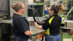 At the Nokian factory in Dayton, Tenn., experienced workers are serving as mentors to new employees on the production floor. Mentor Emily Gatlin works with Trainee Katelyn Peavyhouse. At the Nokian factory in Dayton, Tenn., experienced workers are serving as mentors to new employees on the production floor. Mentor Emily Gatlin works with Trainee Katelyn Peavyhouse.