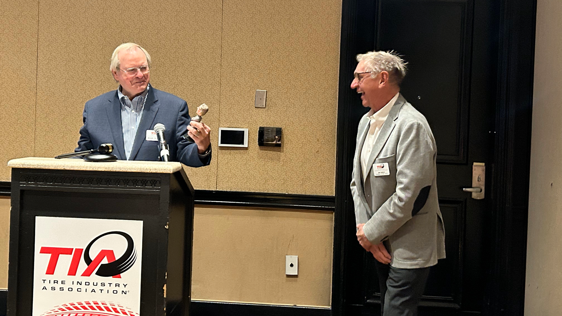 Dick Gust presents Jim Pangle with a customized bobblehead with thanks for his work as TIA board president over the last year. TIA board members in attendance noticed Pangle even wore an outfit that matched that of the bobblehead.