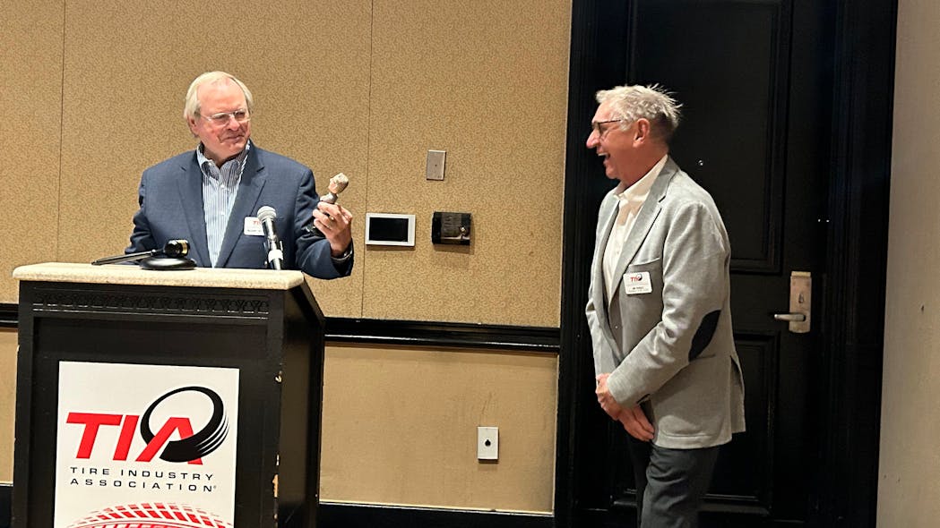Dick Gust presents Jim Pangle with a customized bobblehead with thanks for his work as TIA board president over the last year. TIA board members in attendance noticed Pangle even wore an outfit that matched that of the bobblehead.