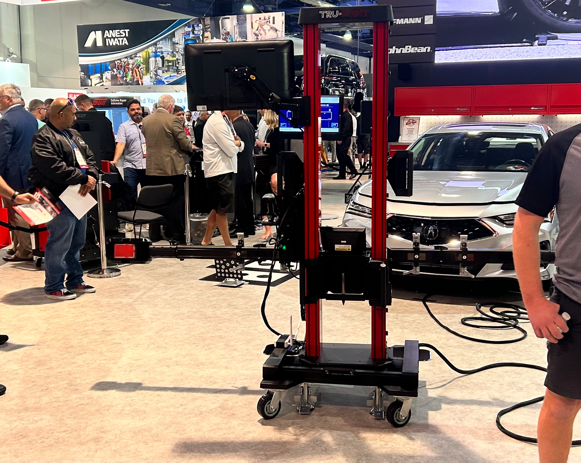 The Tru-Point ADAS calibration system adjusts the height of the target to be in the field of view of the camera while moving equipment out in the distance, automatically compensating for lack of levelness.