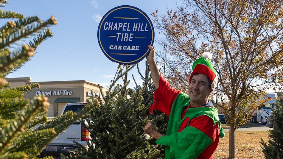 Marc Pons, CEO of Chapel Hill Tire, dressed up as an elf to get customers and employees into the Christmas spirit at his dealership.