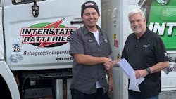Interstate Batteries’ Stefan Gonzalez (left), who recently lost his home in a fire, receives a check from Joel Ayres, executive director of the Automotive Aftermarket Charitable Foundation. Interstate Batteries’ Stefan Gonzalez (left), who recently lost his home in a fire, receives a check from Joel Ayres, executive director of the Automotive Aftermarket Charitable Foundation.