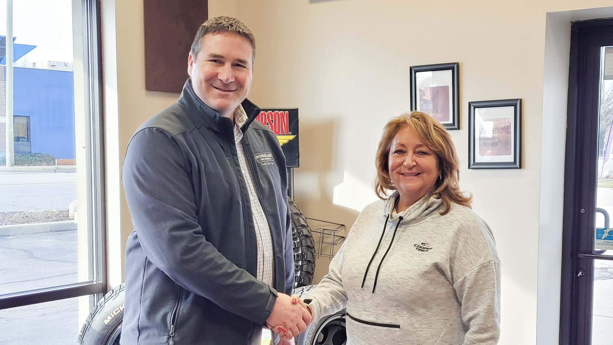'The acquisition of Carter Tire & Automotive will give Wonderland Tire a step into a new area and market,' says Dave Langerak, Wonderland Tire's chief operating officer, pictured with Patti Piscione, former owner of Carter Tire & Automotive.