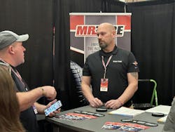 K&amp;M Tire Inc.&rsquo;s Mr. Tire/Big 3 Tire is one of many groups that has expanded its offerings for dealer members. Here, a Mr. Tire/Big 3 Tire representative talks with dealers during K&amp;M Tire&rsquo;s 2024 Dealer Conference and Trade Show.
