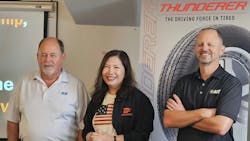 &ldquo;Our job is to make it easy for you to go to market with our tires,&rdquo; AOT CEO Tom Brackin told attendees. (From left to right, Tom; Jane Vongsariyavanich, the CEO of Deestone Co. Ltd.; and AOT President Chris Brackin.)