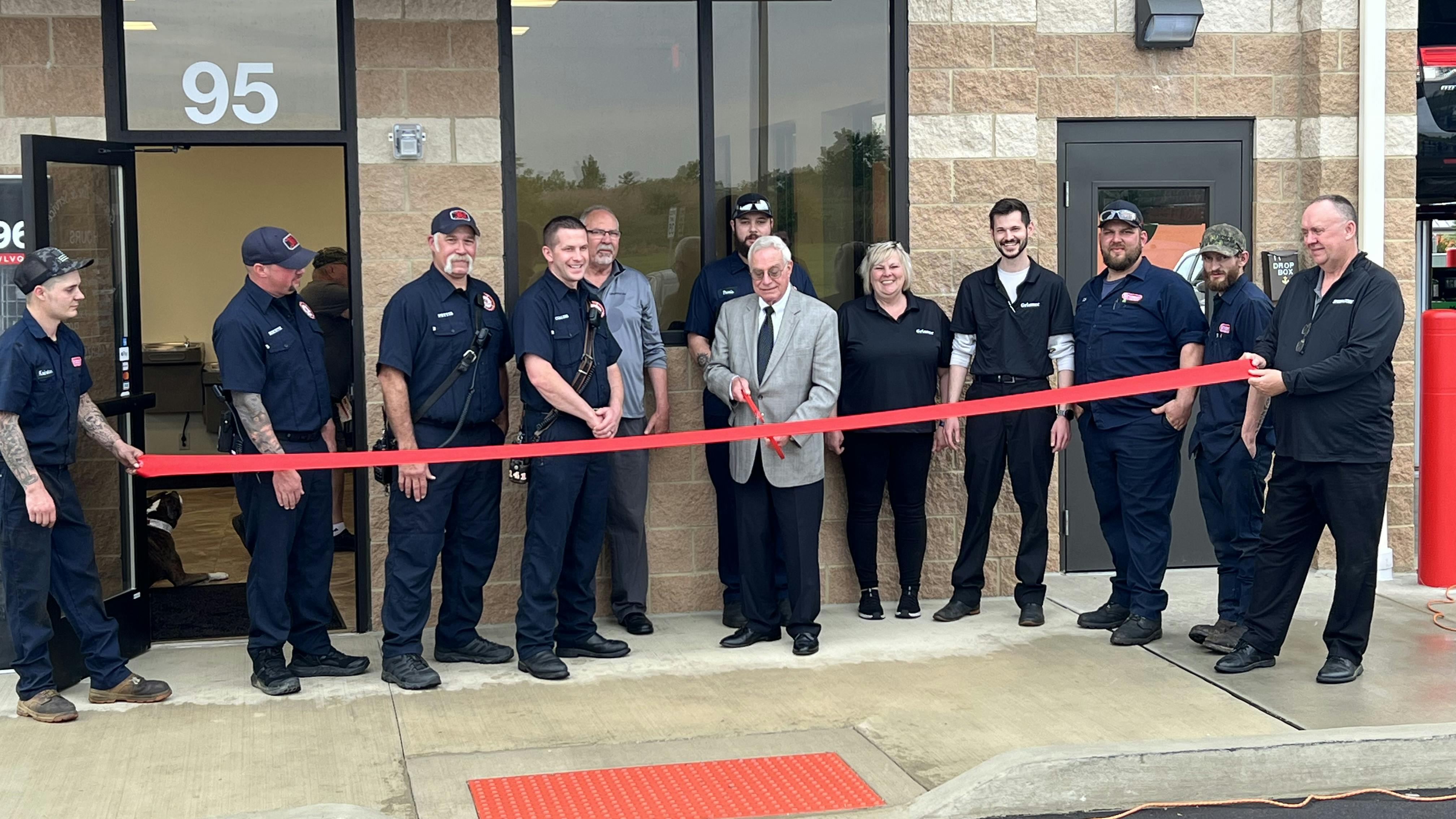 John Marshall, Grismer Tire Co.&rsquo;s executive vice president (retail), cuts the ribbon at the dealership&rsquo;s newest store.
