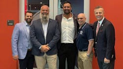 Tony Gonzalez (pictured second from left), the CEO of Tire Group International LLC, says that it has been 'both a blessing and a privilege to give back to Christopher Columbus High School.' Tony Gonzalez (pictured second from left), the CEO of Tire Group International LLC, says that it has been 'both a blessing and a privilege to give back to Christopher Columbus High School.'