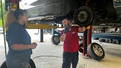 Manager Russ Disalvo talks through a brake service job with Anastasia Dukes, a general service technician at Chabill's Tire & Auto Service. The tire dealership has noticed a trend that its young managers experience less turnover among their youngest staff members. Manager Russ Disalvo talks through a brake service job with Anastasia Dukes, a general service technician at Chabill's Tire & Auto Service. The tire dealership has noticed a trend that its young managers experience less turnover among their youngest staff members.
