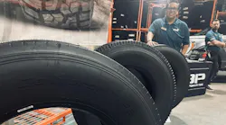 Turbo Wholesale Tires LLC displayed several of its new Rolling Big Power TBR tires during a recent open house event at the company’s Hammond, Ind., distribution center. (Pictured behind tire, JD Casas, Turbo's national sales manager, commercial.)