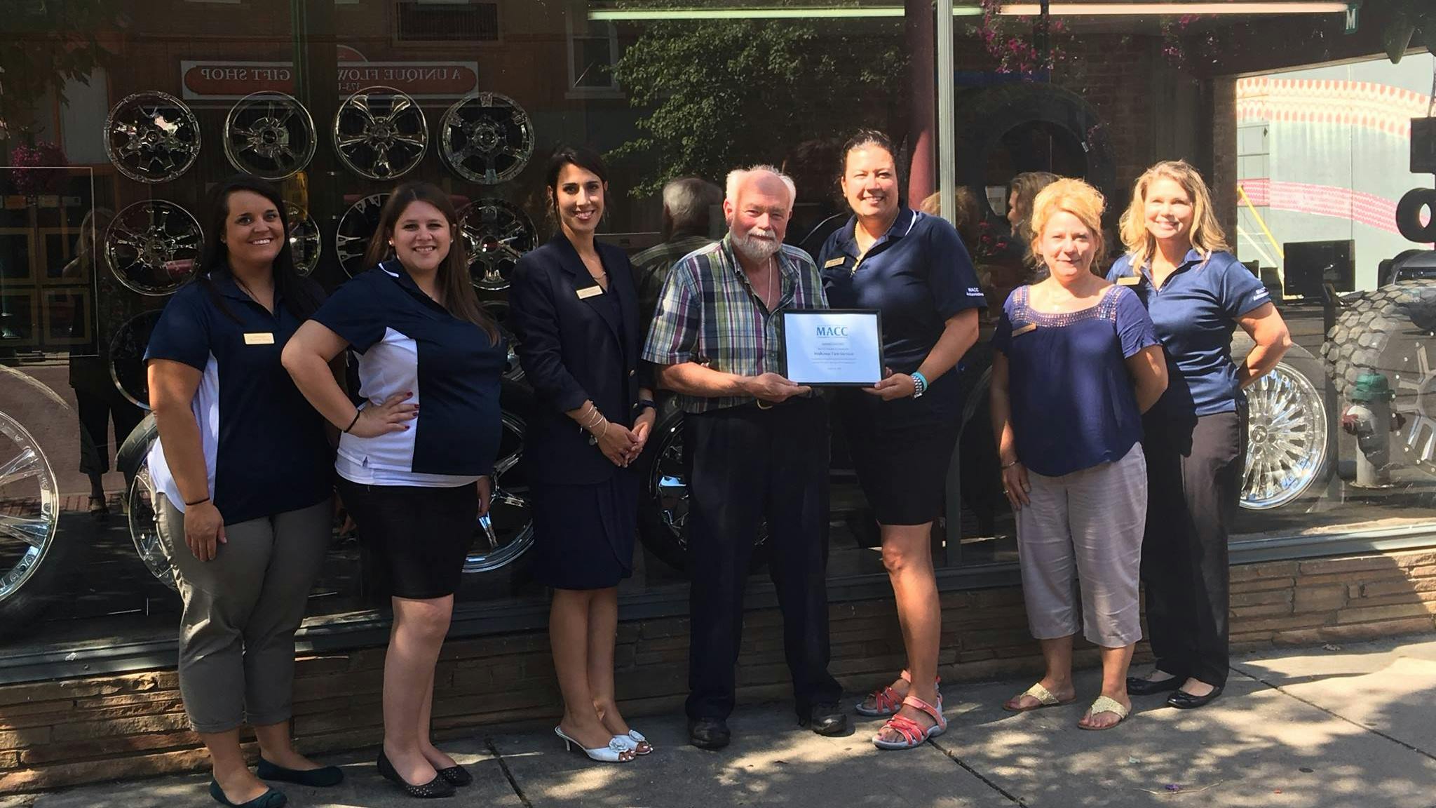 Ted Mahone (center), owner of Mahone Tire in Marietta, Ohio, credits the longevity to a service-oriented approach and involvement in his community.