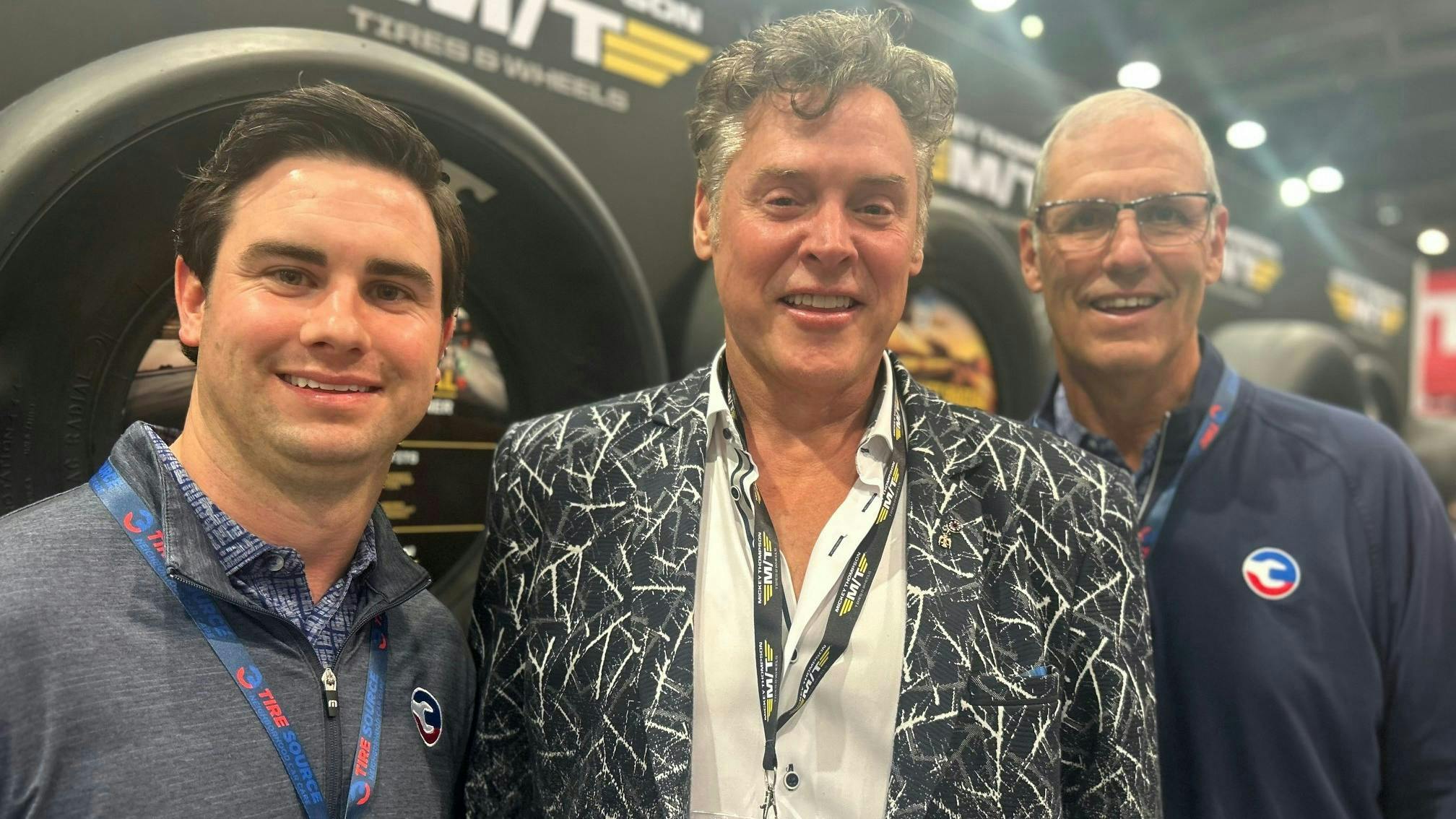 “We want to support our independent retailers, our own retail network (and) the distributors and help them to not just push, but to get pull from end users,” says Stewart, with on left, TJ White of longtime independent Goodyear tire dealership, Tire Source, and right, Tom White, also of Tire Source. “We have to give them the tools to do that.”