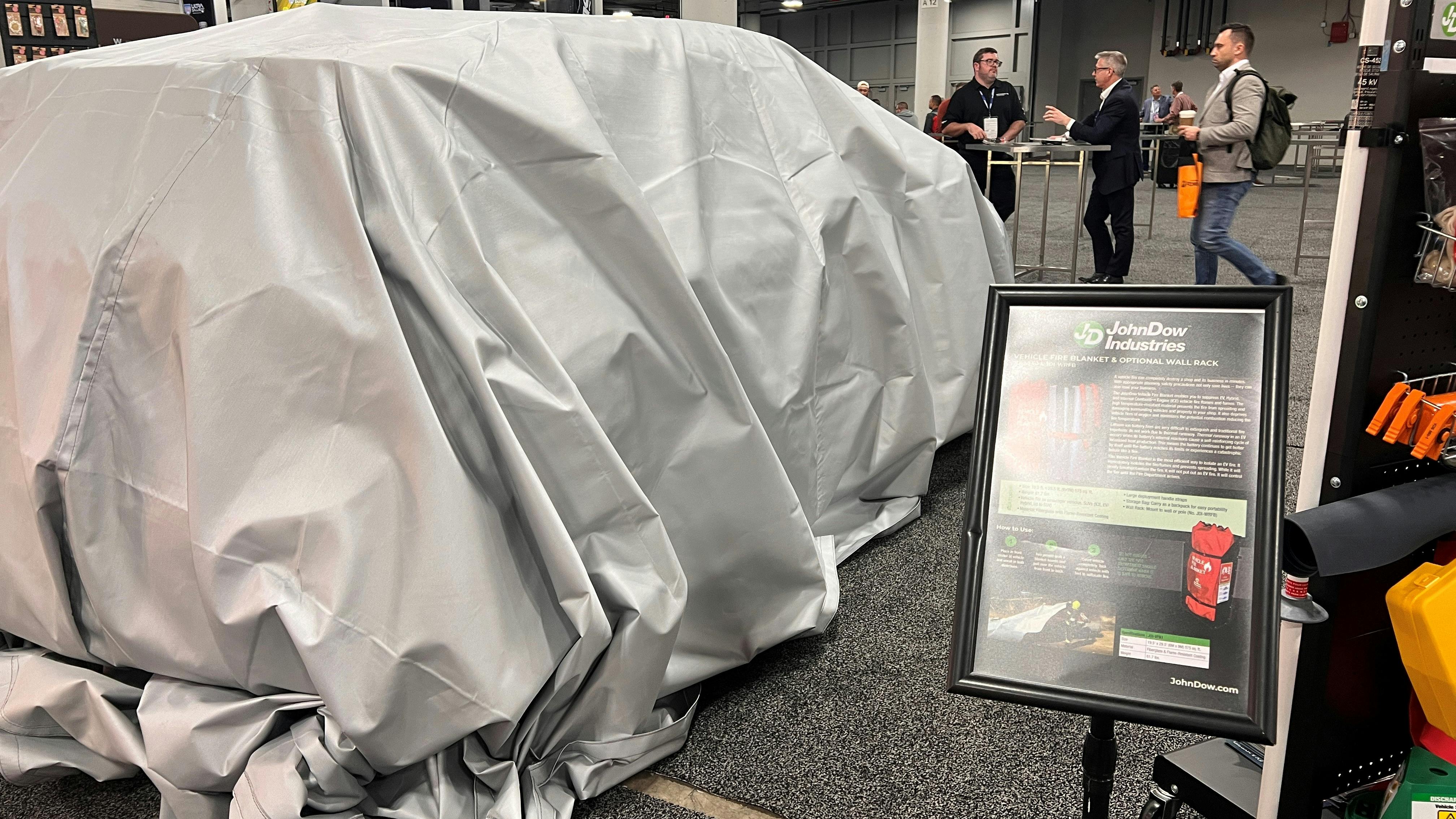 With the Vehicle Fire Blanket on display, some might have mistaken the front of the JohnDow booth as the site of a vehicle giveaway. But the blanket is part of a larger lineup of EV and hybrid safety equipment.