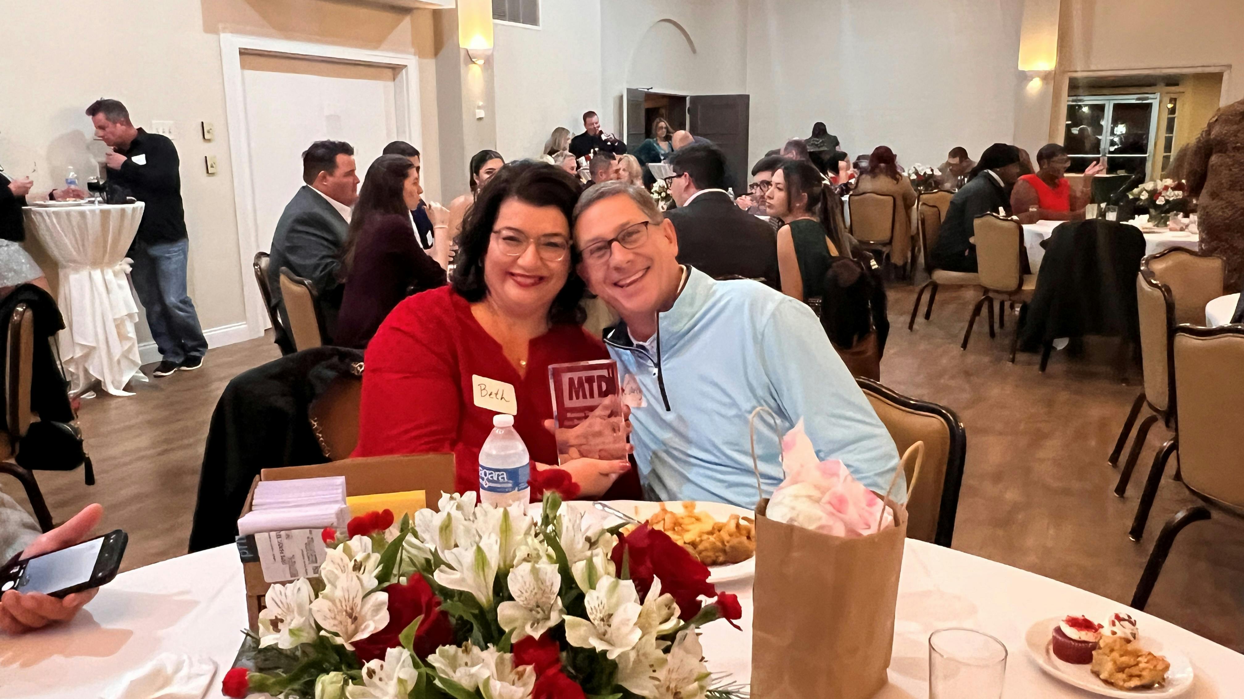 Beth Barron and Carey Barron work side-by-side each day at Chabill's Tire & Auto Service. Here they pose with Beth's new Tire Dealer of the Year trophy.