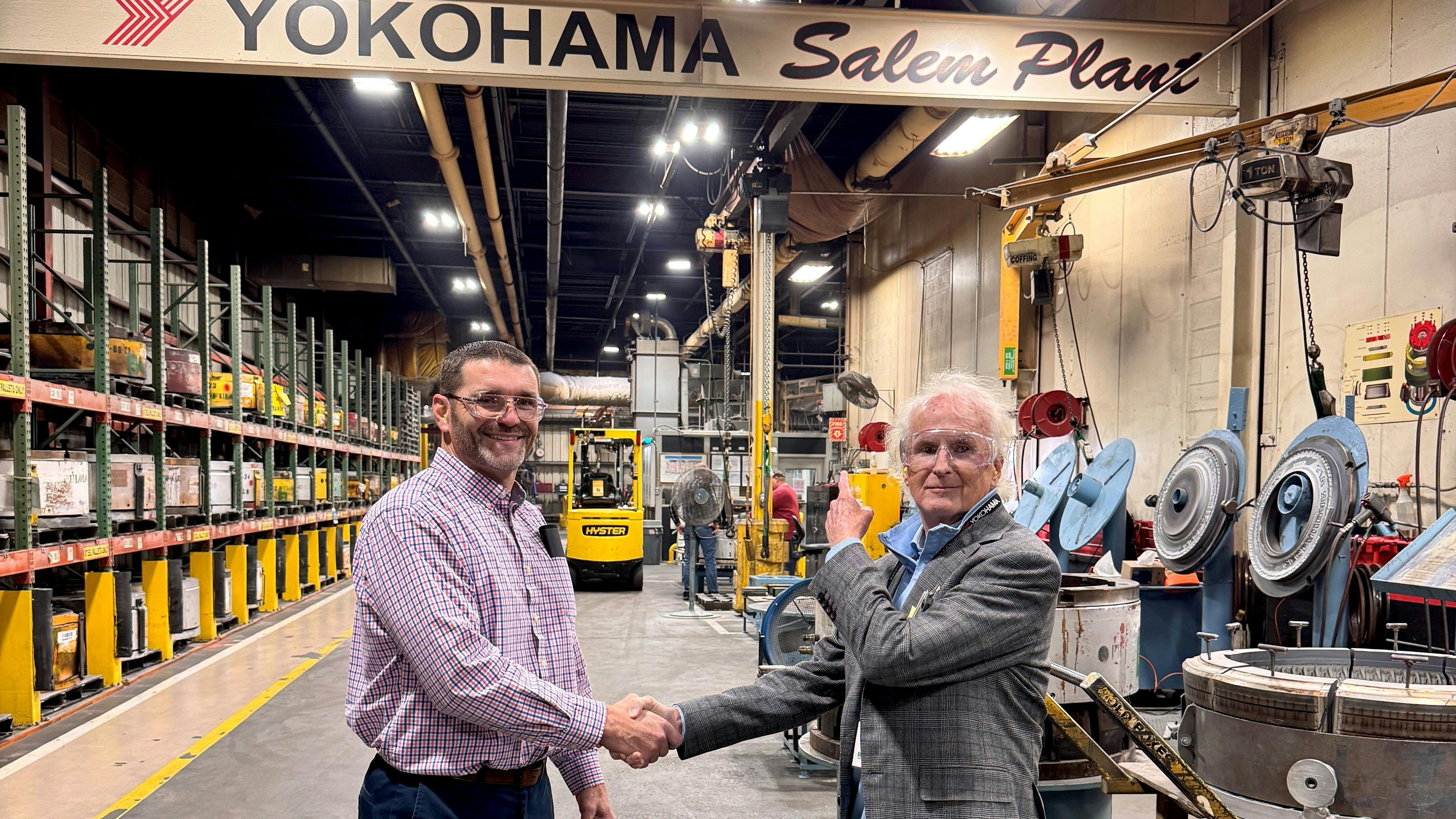 Brian Ballard (left), manager of supply chain planning at Yokohama Tire Corp.'s plant in Salem, Va., welcomes Paul Sullivan, vice president of marketing for Sullivan Tire Co. Inc.