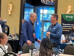 Walter Lybeck, left, CEO of Point S USA and Tire Factory Inc., talks with Prinx Chengshan Tire North America Inc. President Samuel Felberbaum during the Point S trade show. Sixty-three vendors participated in the trade show during the Point S annual dealer meeting. Walter Lybeck, left, CEO of Point S USA and Tire Factory Inc., talks with Prinx Chengshan Tire North America Inc. President Samuel Felberbaum during the Point S trade show. Sixty-three vendors participated in the trade show during the Point S annual dealer meeting.