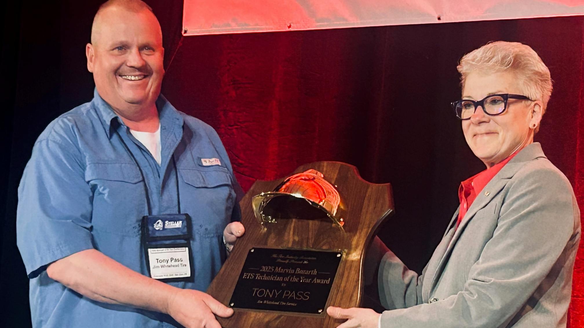 TIA President Debra Hamlin presented the Marvin Bozarth ETS Technician of the Year Award to Tony Pass of Jim Whitehead&rsquo;s Best-One Tire & Service in Oakwood, Ga. &ldquo;I feel like I&rsquo;m in a dream,&rdquo; said Pass upon receiving the honor in front of 500 OTR Tire Conference attendees.