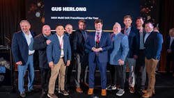 Gus Herlong of Palmetto Garage Works in Columbia, S.C. - joined here by his employees and Ralph Luberda, Midas vice president - was named Midas Franchisee of the Year in the multi-unit category. Gus Herlong of Palmetto Garage Works in Columbia, S.C. - joined here by his employees and Ralph Luberda, Midas vice president - was named Midas Franchisee of the Year in the multi-unit category.