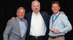 Chris Barry, vice president of sales for the Independent Tire Dealers Group LLC (ITDG), pictured on far left, and ITDG President and CEO Jason Rook (center) presented the ITDG Dealer of the Year Award to John Daniels of Santa Fe Springs, Calif.-based Daniels Tire Service Inc (right, holding trophy.)