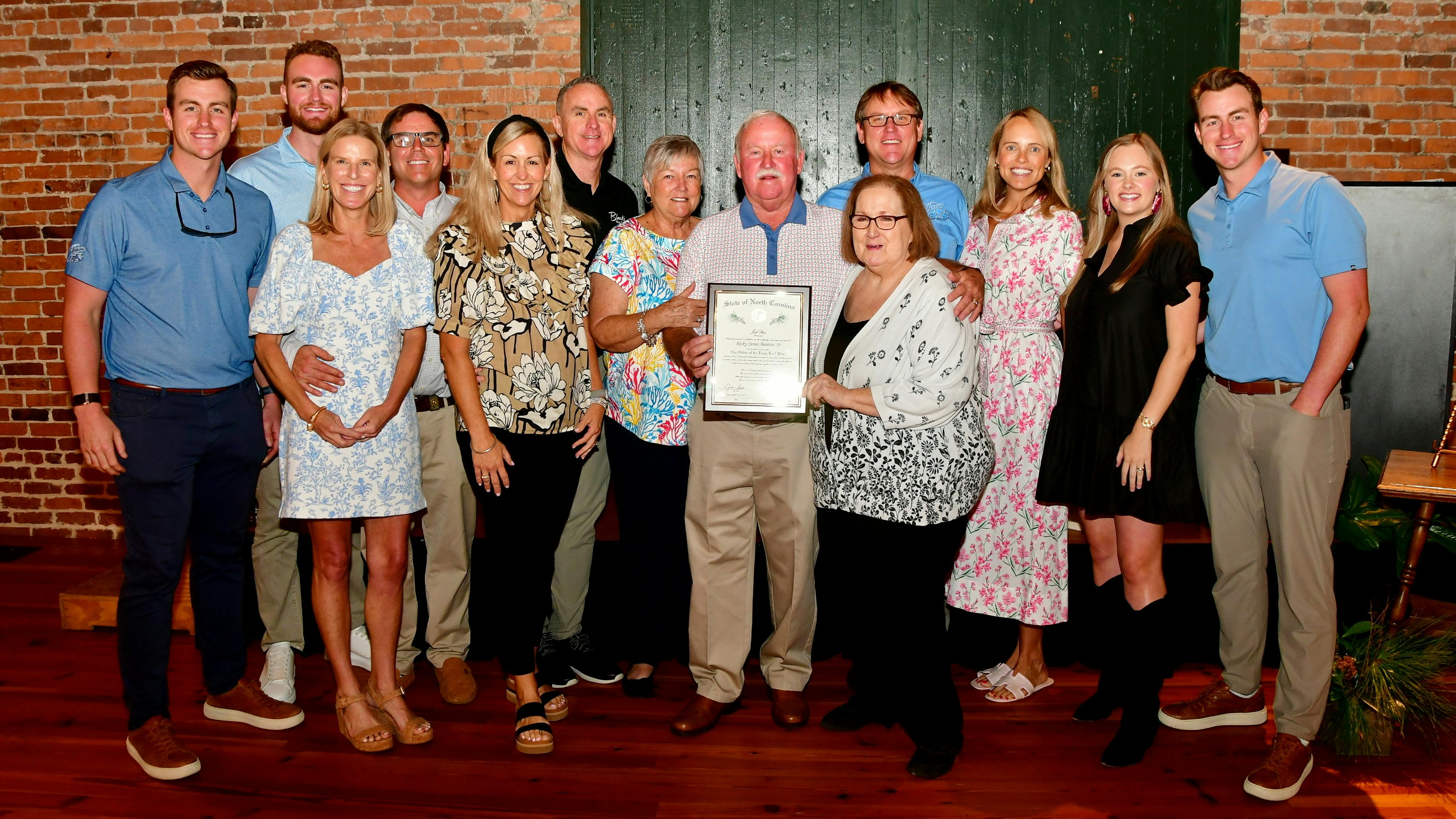 Generations of the Benton family gathered to celebrate Ricky Benton, president of Black's Tire Service Inc., receiving the Order of the Long Leaf Pine.
