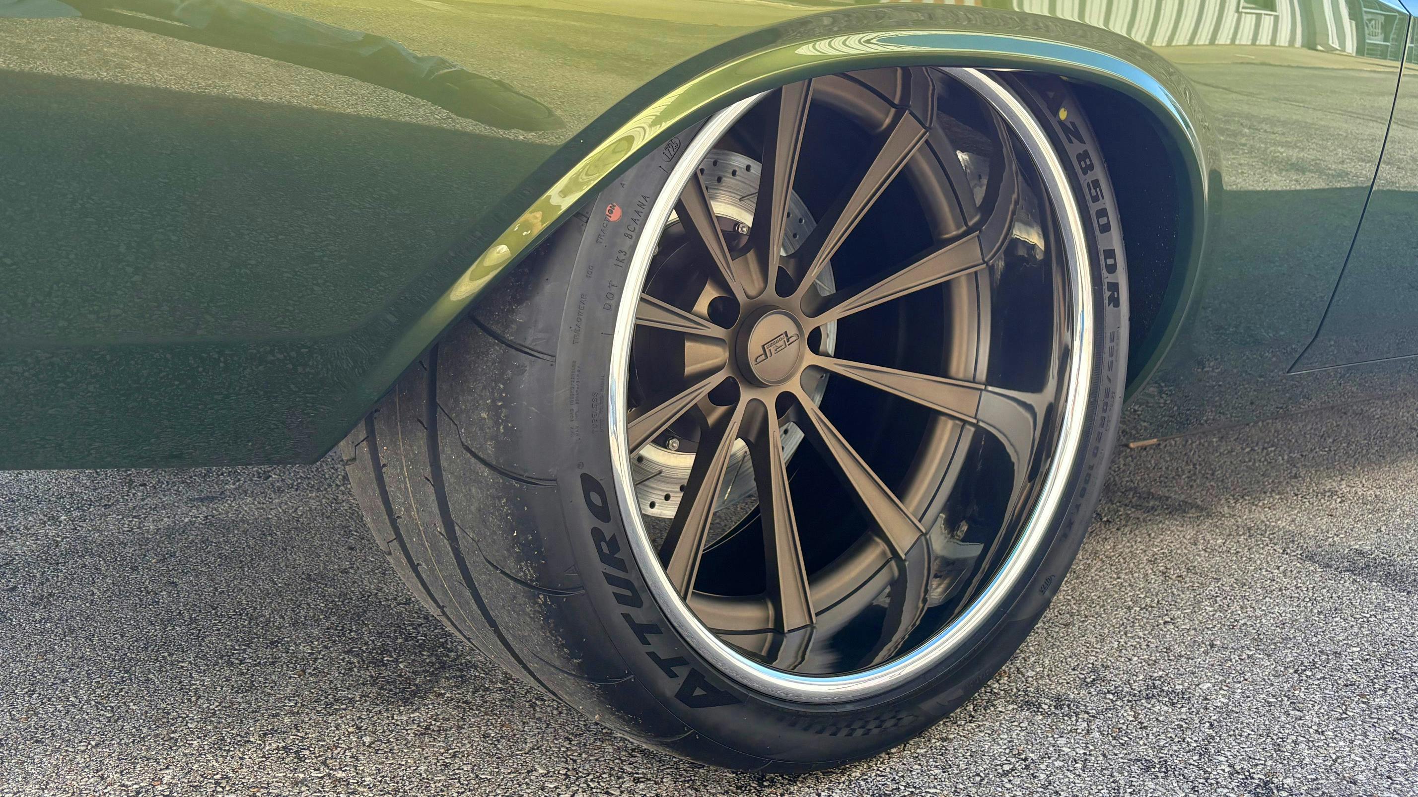'The car rides on 19/20-inch Forgeline Dropkick wheels with matte bronze centers and polished outers, wrapped in Atturo AZ850 245/35R19 ultra-high performance tires in the front,' say Atturo Tire Corp. officials.