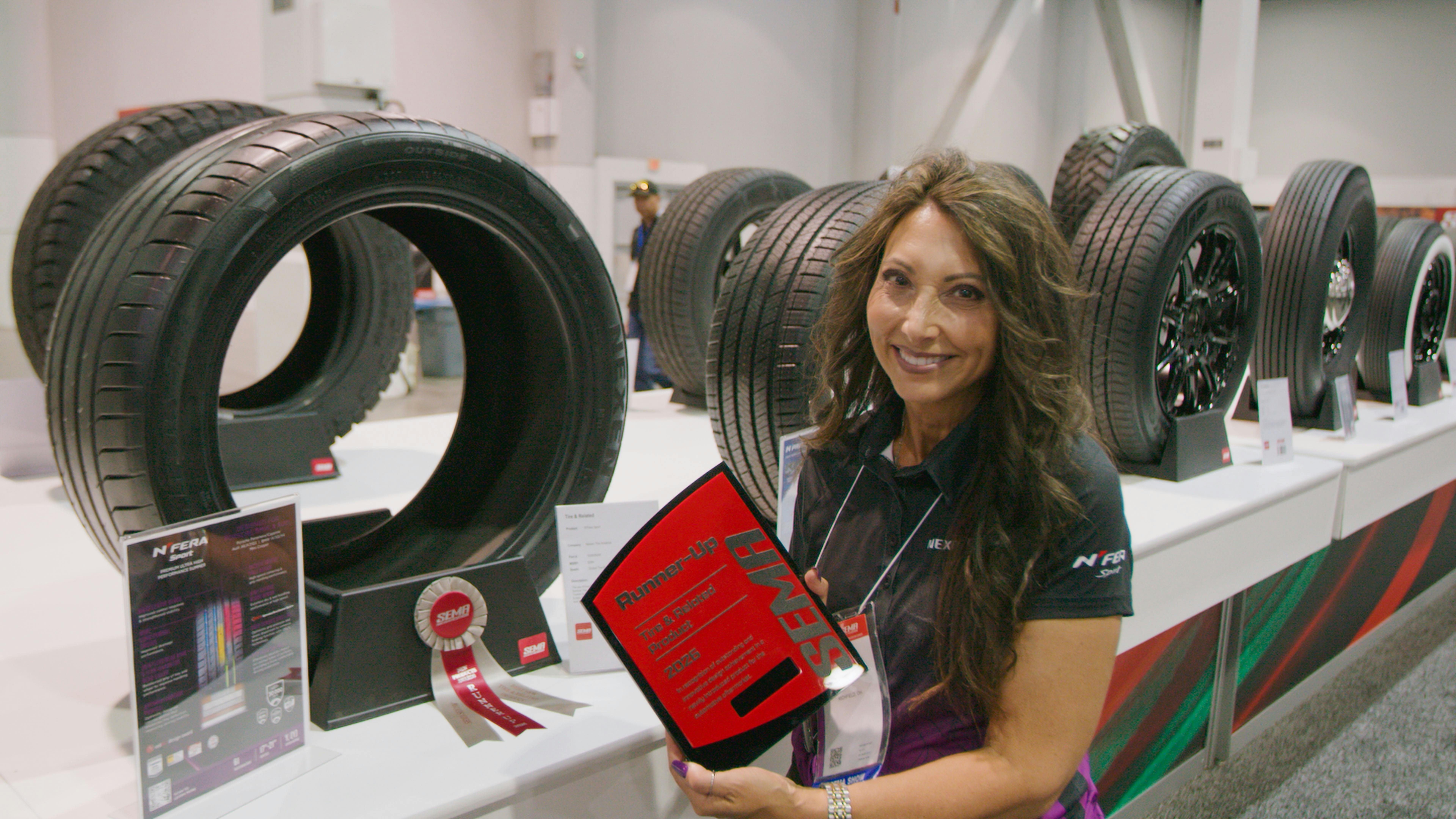 The N'Fera Sport was one of the many tires that Nexen showcased inside its SEMA Show booth. (Pictured, Theresa Kapper, Nexen's marketing director.)