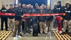 Brock Swentzel, president of S&S Tire's wholesale division, marks the first load of tires at the company's new distribution center in Acworth, Ga.. with a ribbon cutting. Brock Swentzel, president of S&S Tire's wholesale division, marks the first load of tires at the company's new distribution center in Acworth, Ga.. with a ribbon cutting.