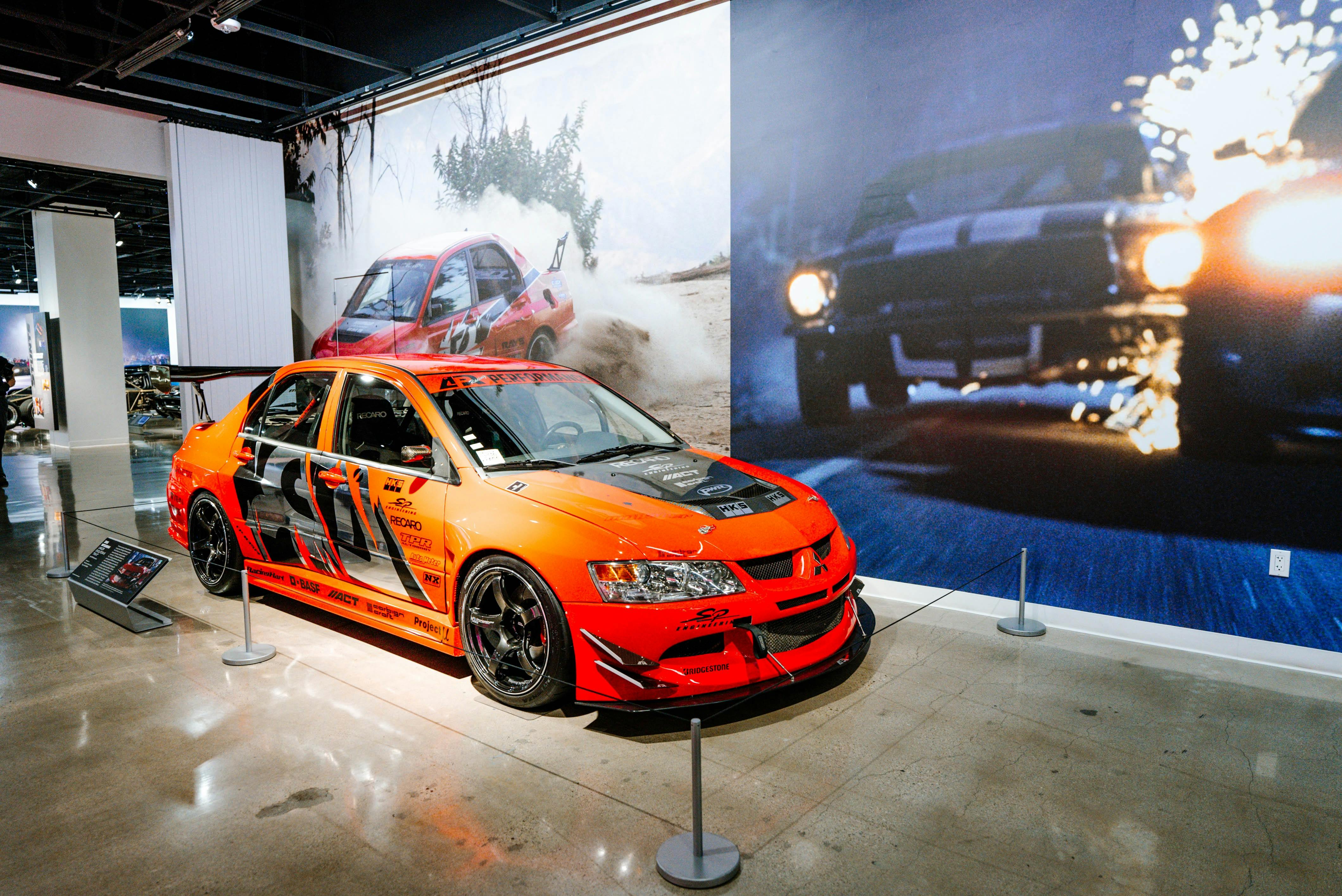 The 2005 Mitsubishi Evo VIII hero car, personally owned by Williams, features Bridgestone Potenza RE-71RS tires and will be on display alongside other iconic cars from the film franchise through April 2027.