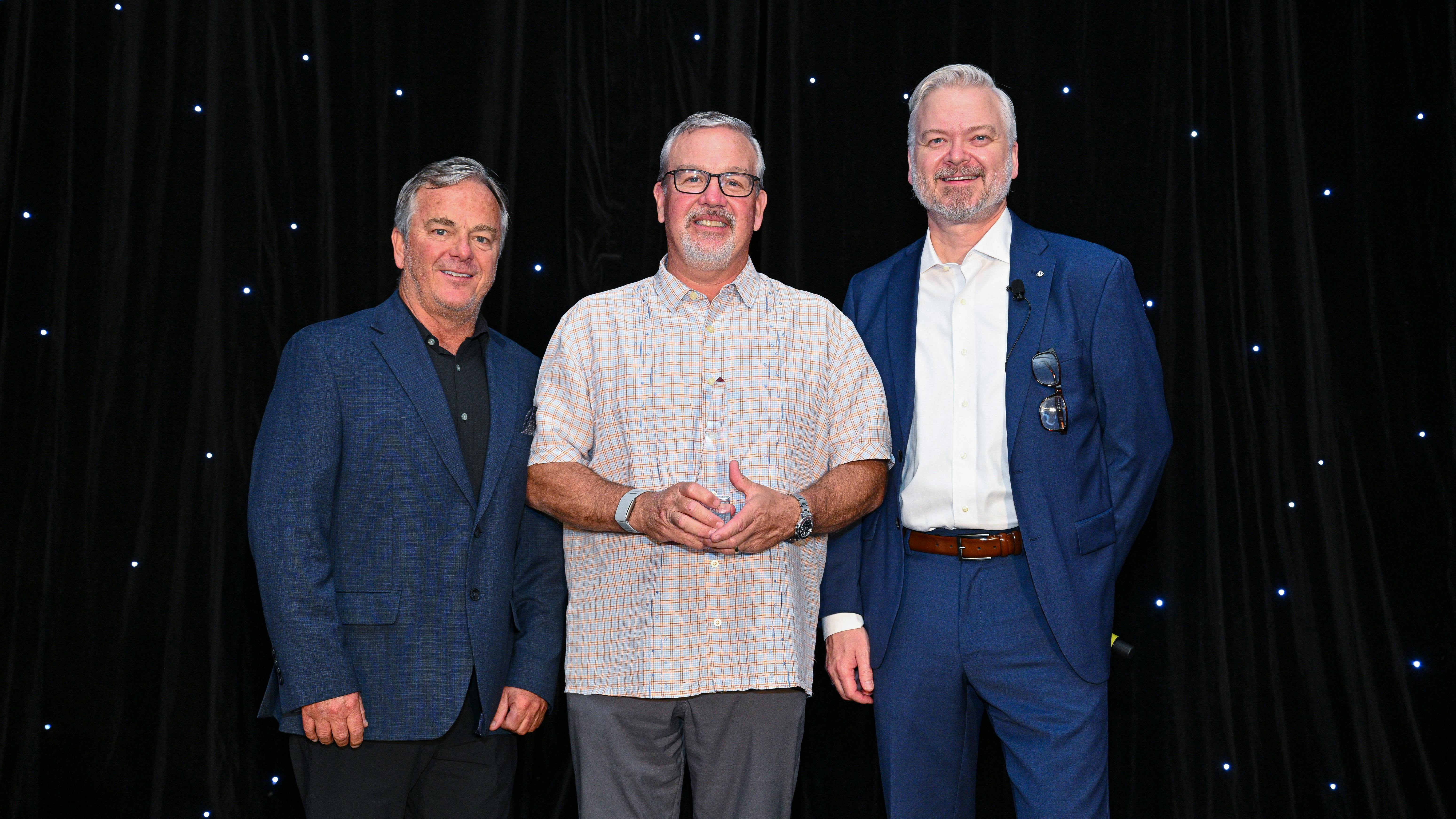 Jason Rook, president and CEO of the Independent Tire Dealers Group LLC (ITDG), pictured on right, with Chris Barry, ITDG's vice president of sales, left, and ITDG's Dealer of the Year Award winner, middle, during the group's recent meeting.