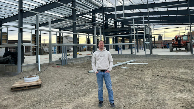 Ryan Anderson, president of Montana Tire Distributors and Montana Tire & Alignment, stands on the site of what will be Montana Tire & Alignment's new retail store, which is under construction.