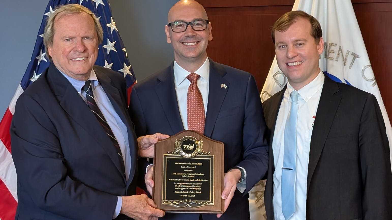 Jonathan Morrison, administrator of the National Highway Traffic Safety Administration (pictured, center), recently received the TIA Leadership Award.